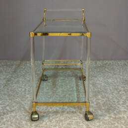 Two Glass Shelves Plexiglas, glass, and brass trolley