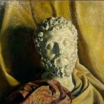 Still-life composition centered on a sculpted head, surrounded by fabric in warm tones