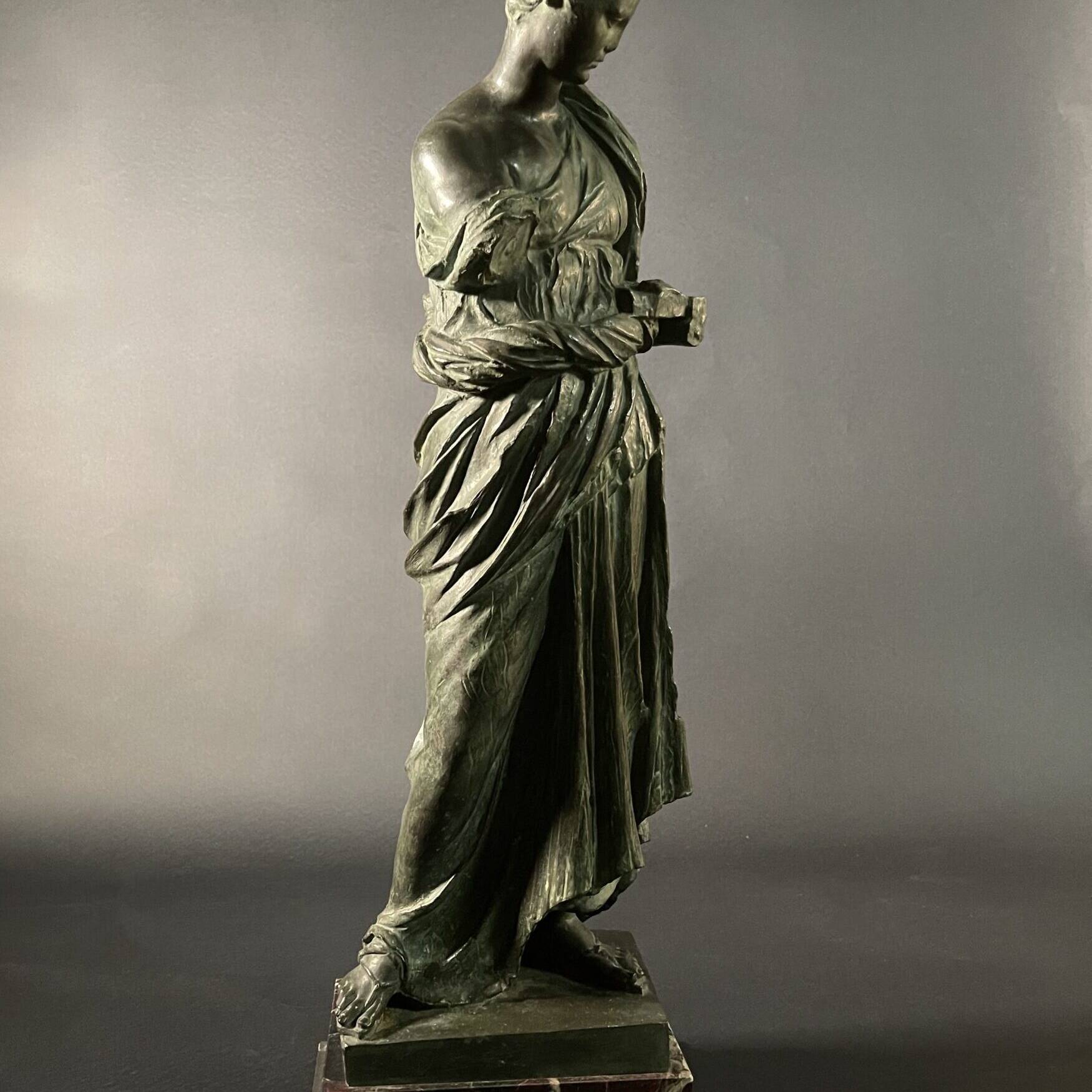 Maiden of Anzio by Nisini, bronze in the neoclassical taste on a polychrome marble base.