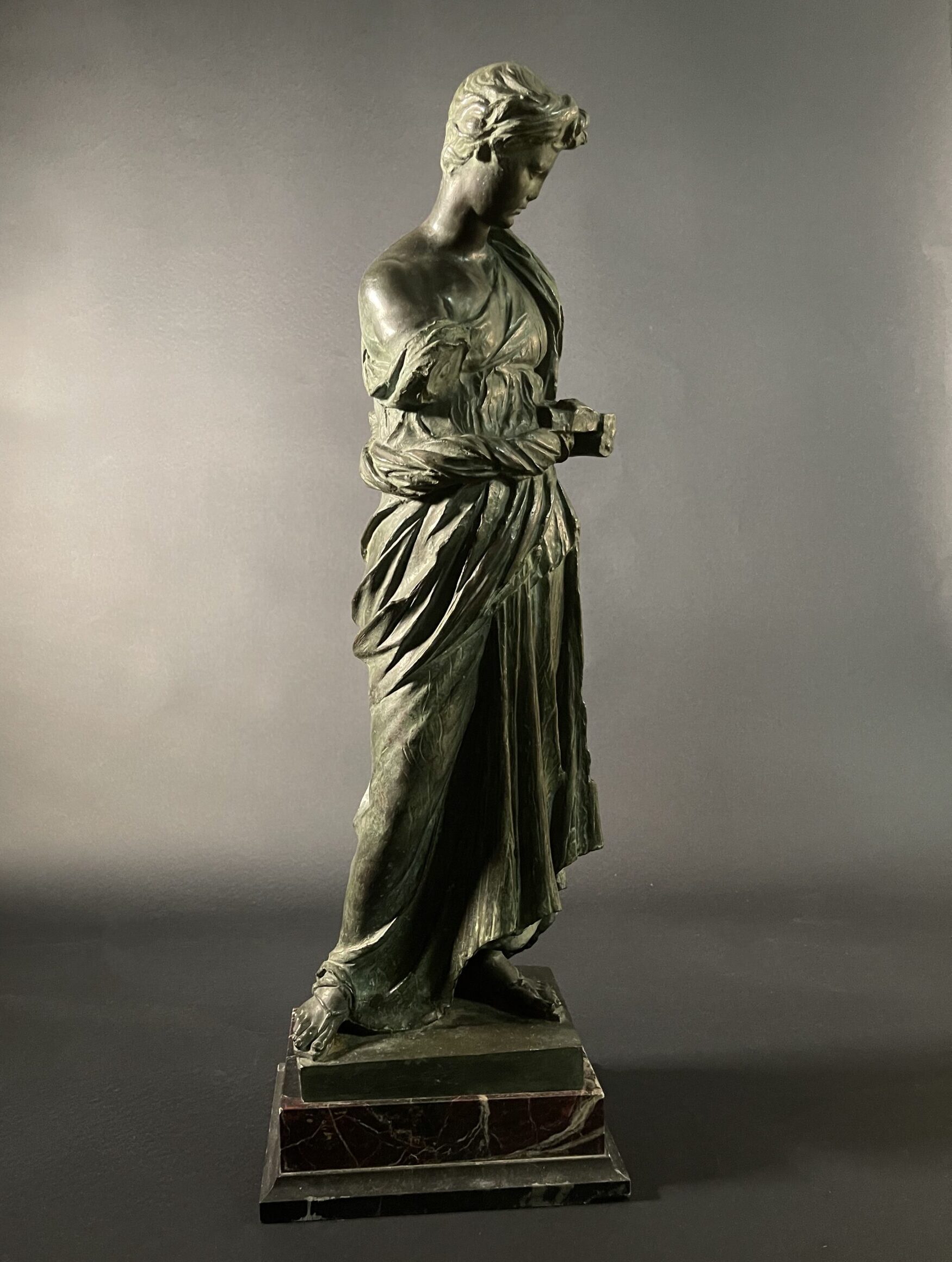 Maiden of Anzio by Nisini, bronze in the neoclassical taste on a polychrome marble base.
