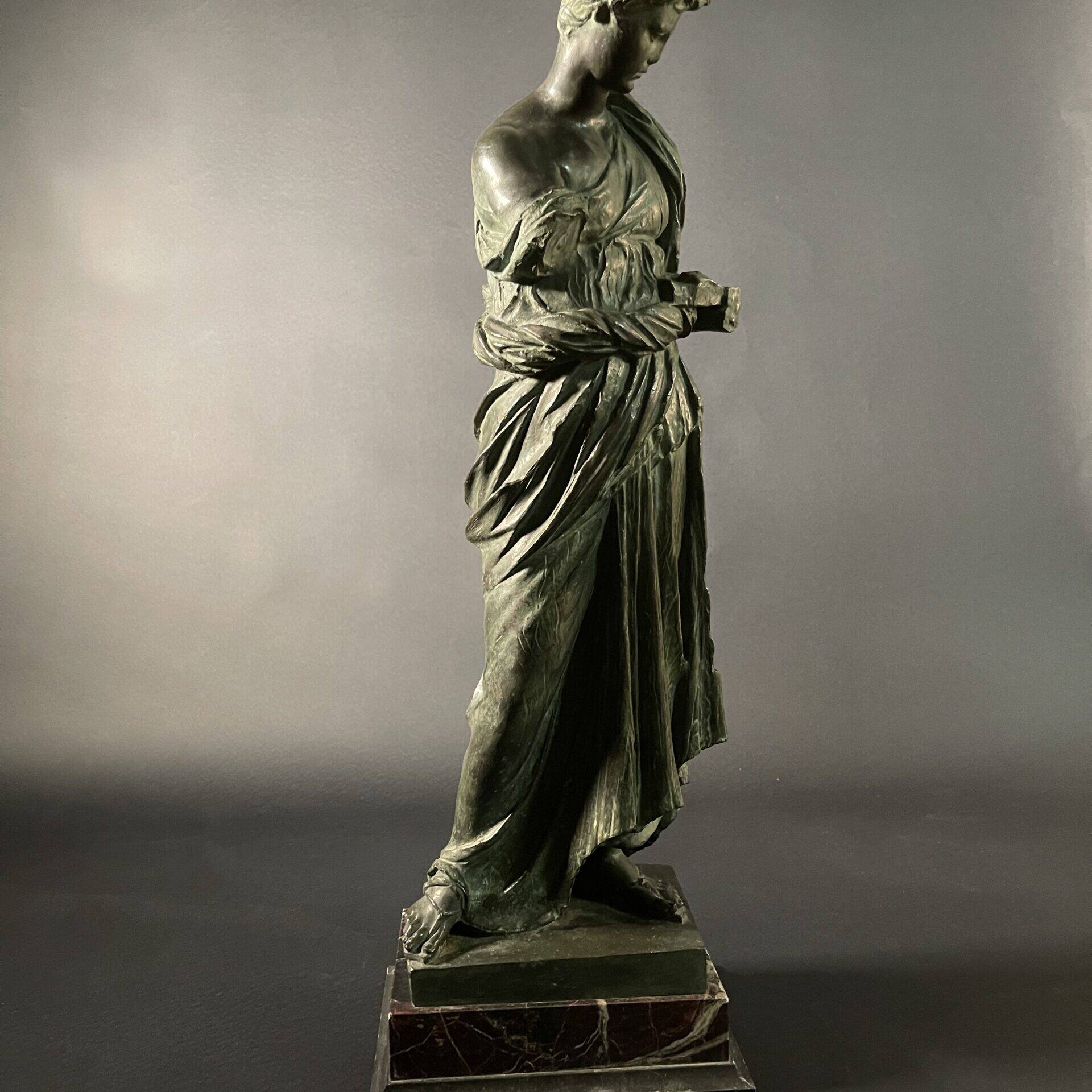 Maiden of Anzio by Nisini, bronze in the neoclassical taste on a polychrome marble base.